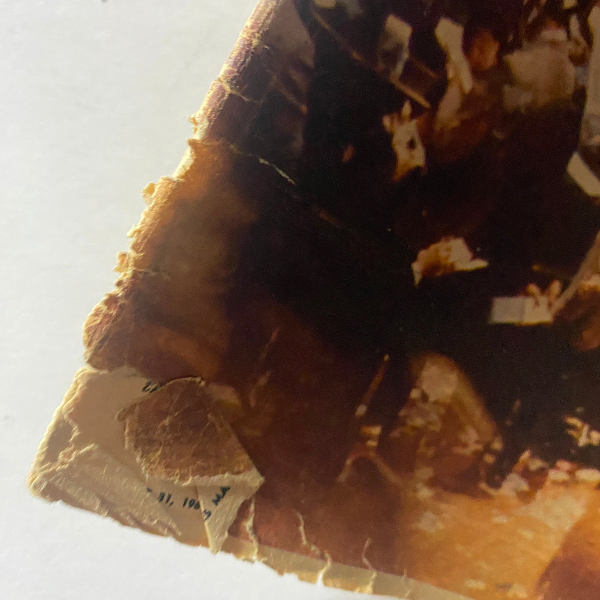 Close-up image of the damaged corner of The New York Times Magazine from August 31, 1969, illustrating the wear and tear of the vintage publication, further emphasizing its historical value.