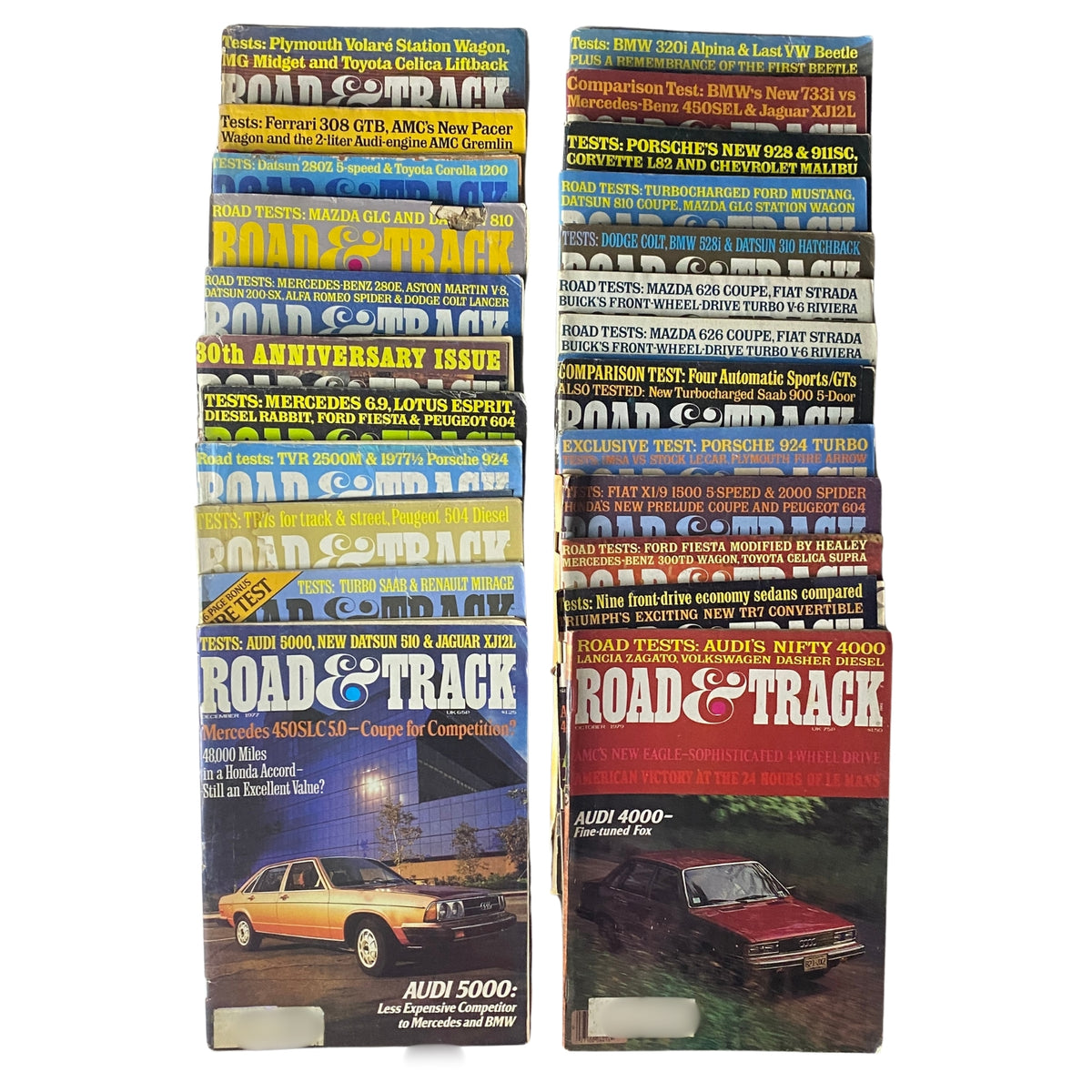 Lot of 24 Road & Track Magazines from 1976 to 1979 showing various issues stacked together, highlighting the 30th Anniversary Issue and featuring classic car tests.