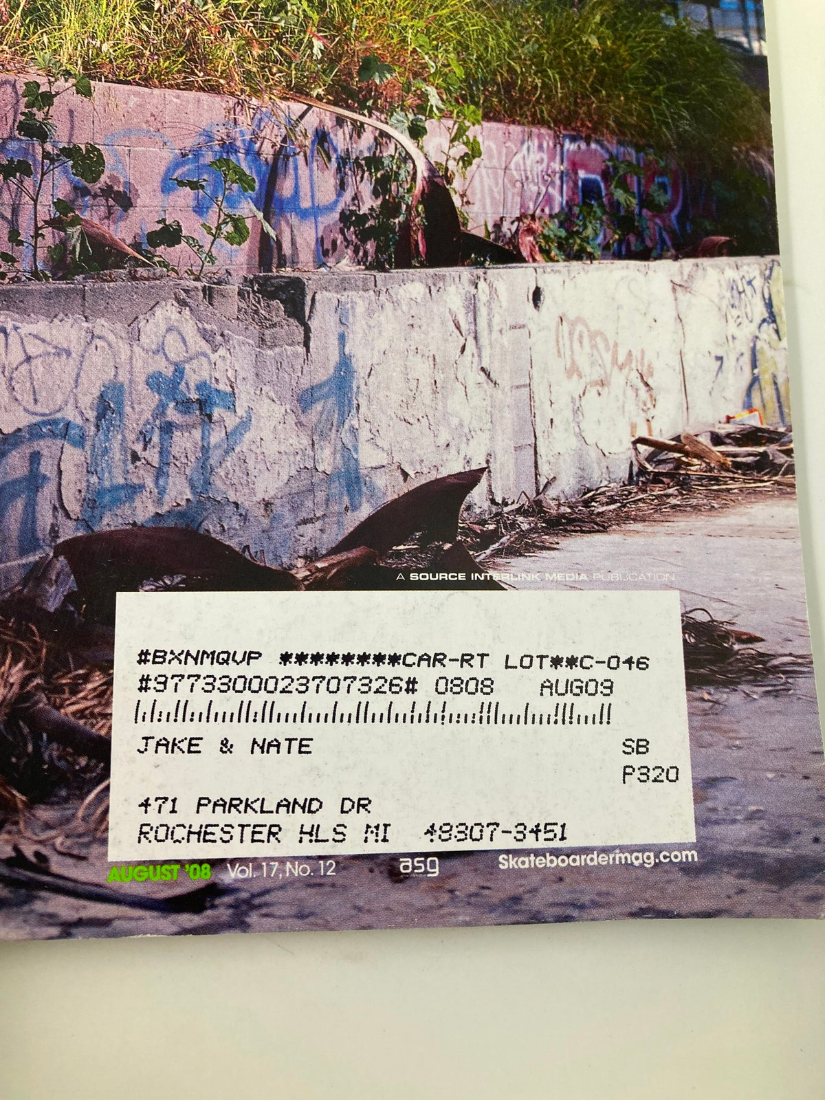 Back cover of Skateboarder Magazine August 2008 Vol 17 #12 with an address label and graffiti background.