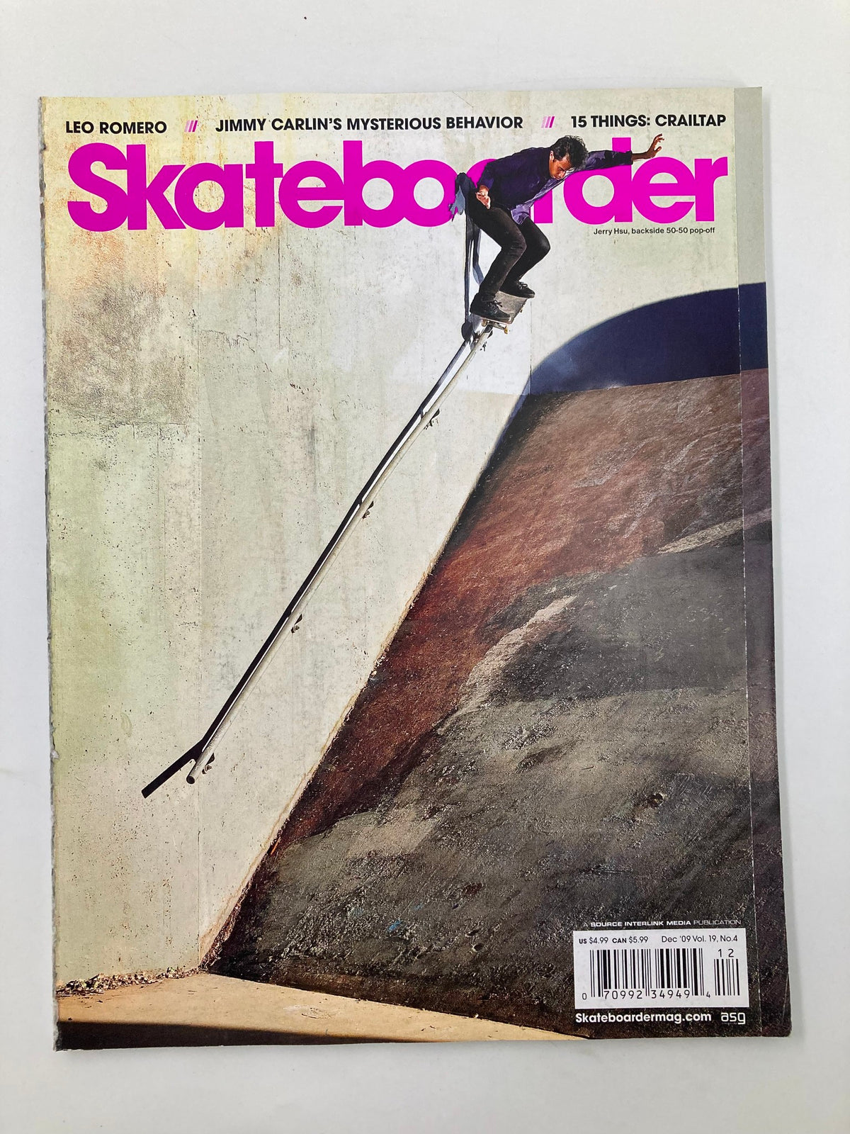 Skateboarder Magazine December 2009 featuring Jerry Hsu performing a Backside 50-50 Pop-Off on the cover, showcasing skateboarding culture and style.