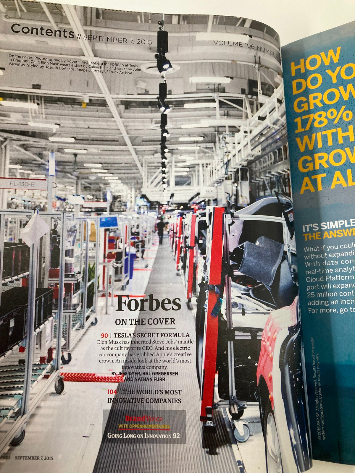 Contents page of Forbes Magazine September 7, 2015, showcasing an article about Elon Musk and Tesla's secret formula amidst a factory backdrop.