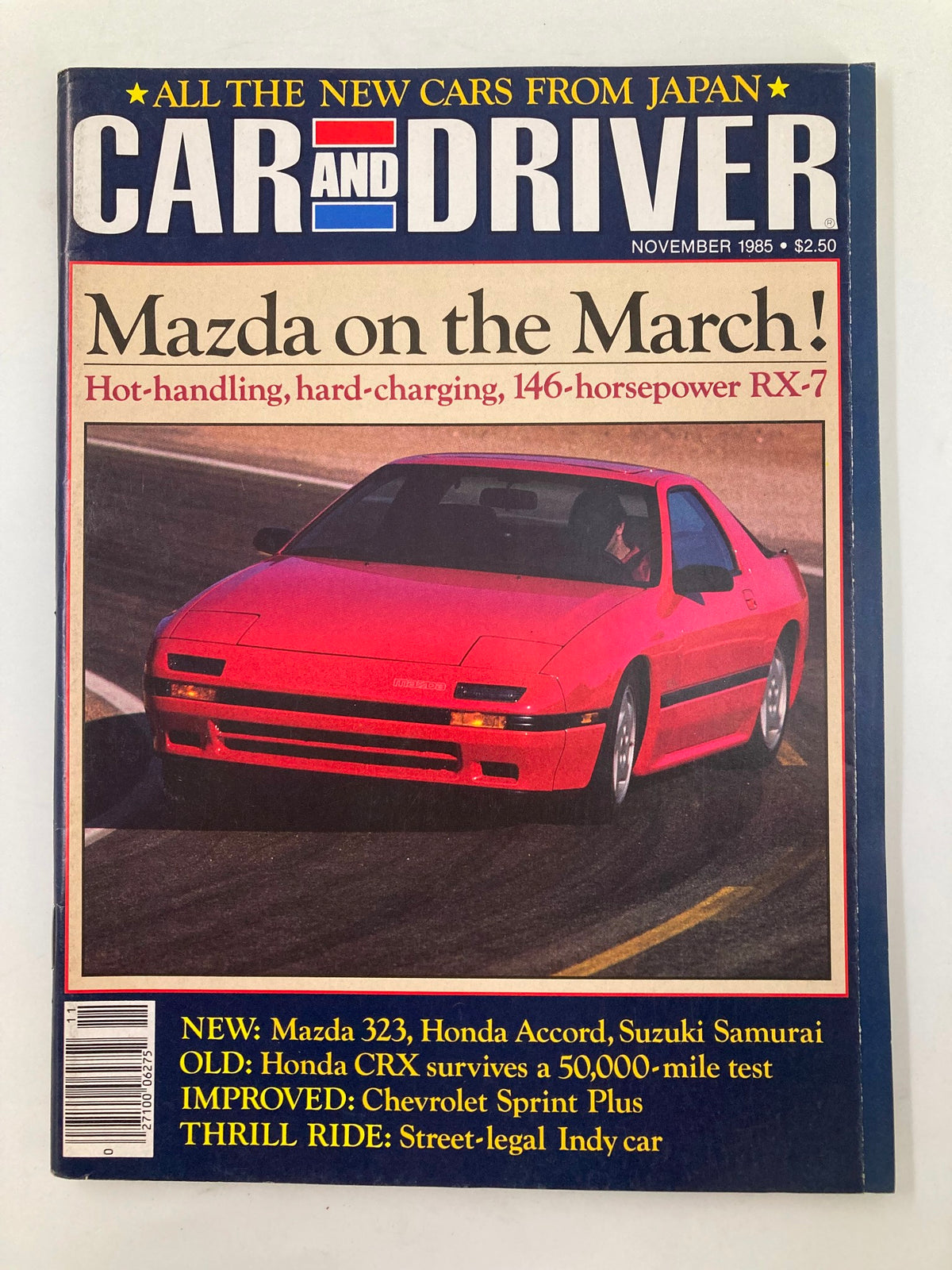 Car and Driver Magazine November 1985 featuring the iconic 146-hp Mazda RX-7, showcasing its dynamic design on the cover.