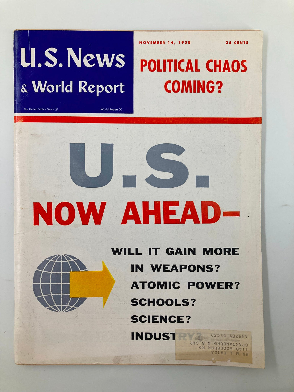 Cover of US News & World Report Magazine from November 14, 1958, featuring the headline 'U.S. Now Ahead in Weapons', with graphics indicating global influence and topics such as atomic power, schools, science, and industry.