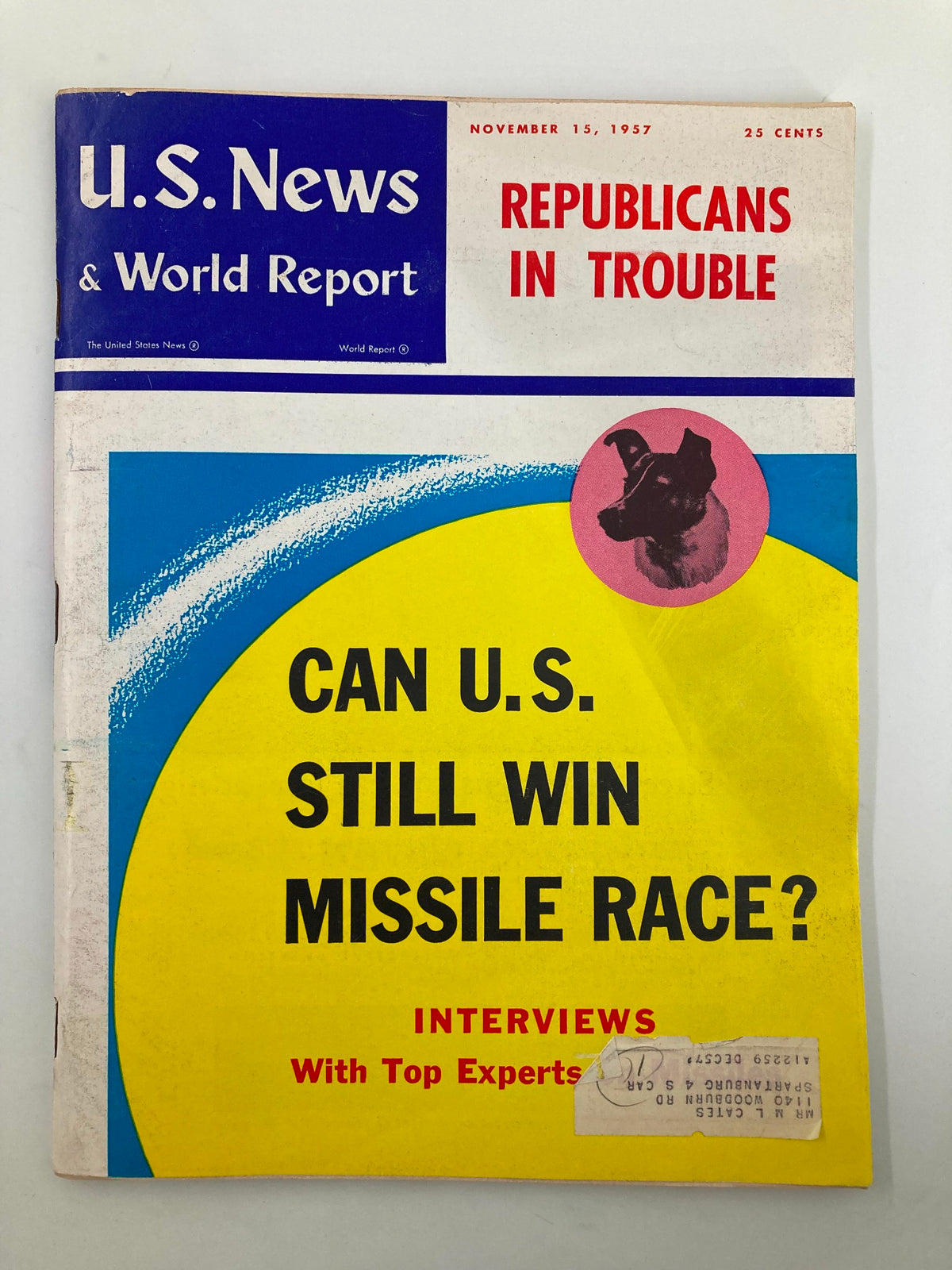 Cover of US News & World Report magazine dated November 15, 1957, featuring the headline 'Can U.S. Still Win Missile Race?' along with discussions on Cold War missile technology, showcasing a vintage design with a colorful layout and a dog illustration.