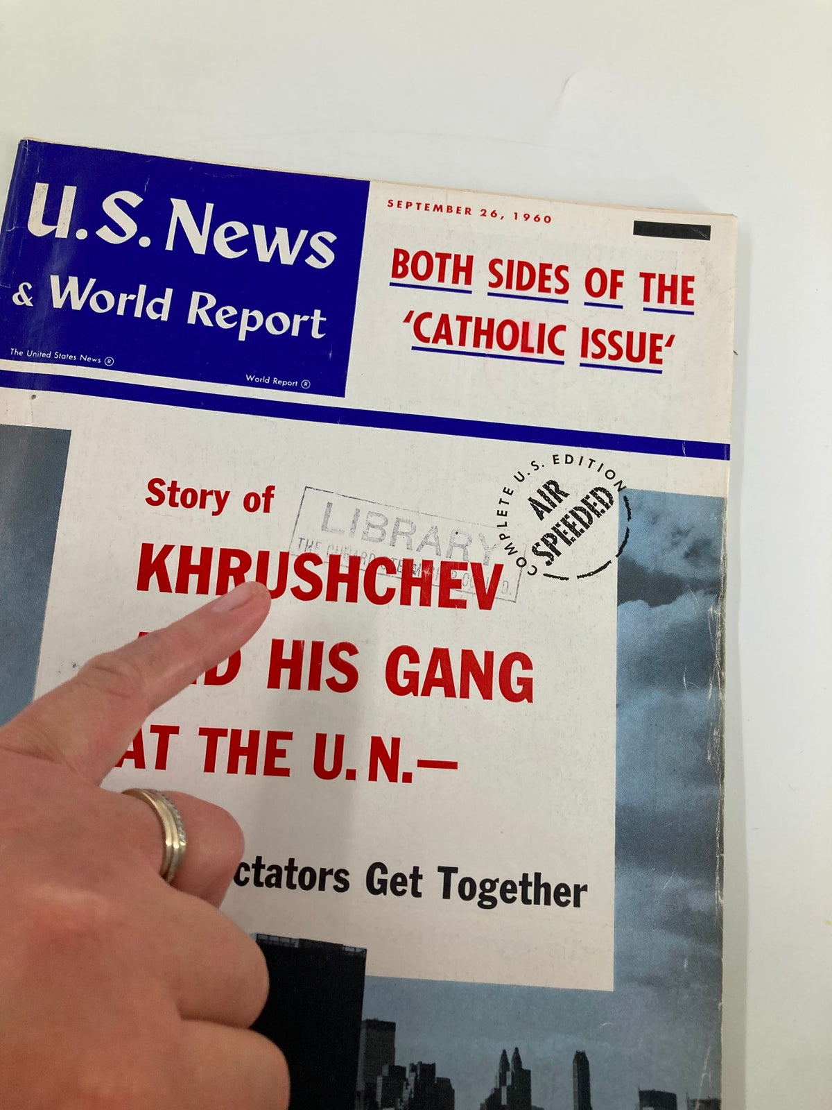 Close-up of the US News & World Report Magazine cover from September 26, 1960, highlighting the title 'Both Sides of the Catholic Issue' and showing a library stamp.