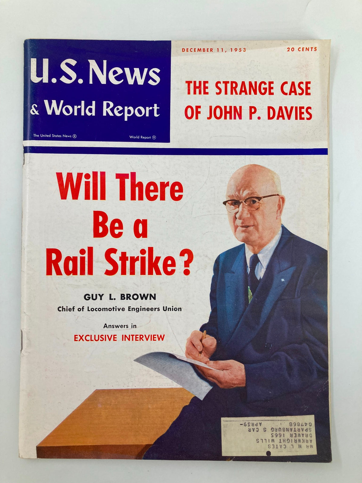 Cover of US News & World Report Magazine December 11, 1953 featuring the article 'The Strange Case of John P. Davies' with a headline about a potential rail strike and an exclusive interview with Guy L. Brown.