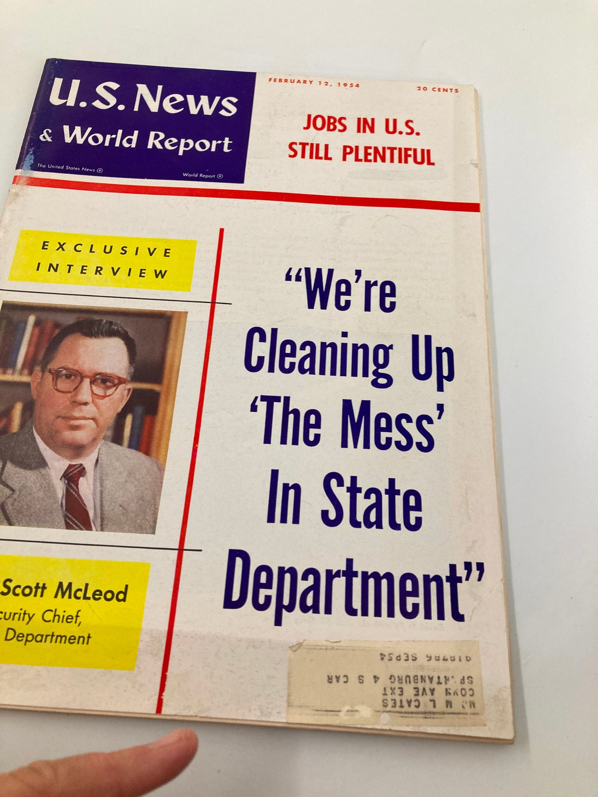 Cover image of US News & World Report Magazine February 12, 1954, showcasing an interview with R. W. Scott McLeod and the prominent title 'We're Cleaning Up The Mess In State Department'.