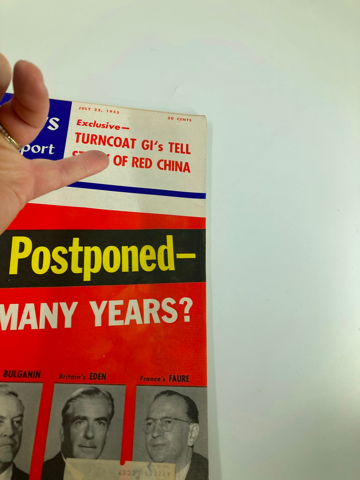 Close-up of the cover of US News & World Report Magazine July 22, 1955, highlighting the title 'Exclusive - Turncoat GI's Tell Story of Red China' alongside 'War Postponed'.