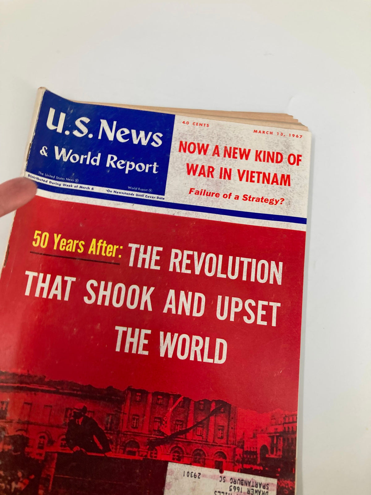 Close-up of the cover of US News & World Report Magazine dated March 13, 1967, emphasizing the title 'Now A New Kind of War in Vietnam' with eye-catching graphics and historical reference.