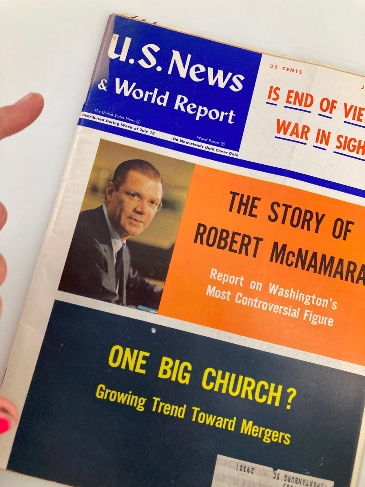 Close-up of the cover of US News & World Report Magazine from July 25, 1966. The cover highlights 'The Story of Robert McNamara' and includes the question 'Is End of Vietnam War in Sight?'. An iconic piece reflecting historical context.