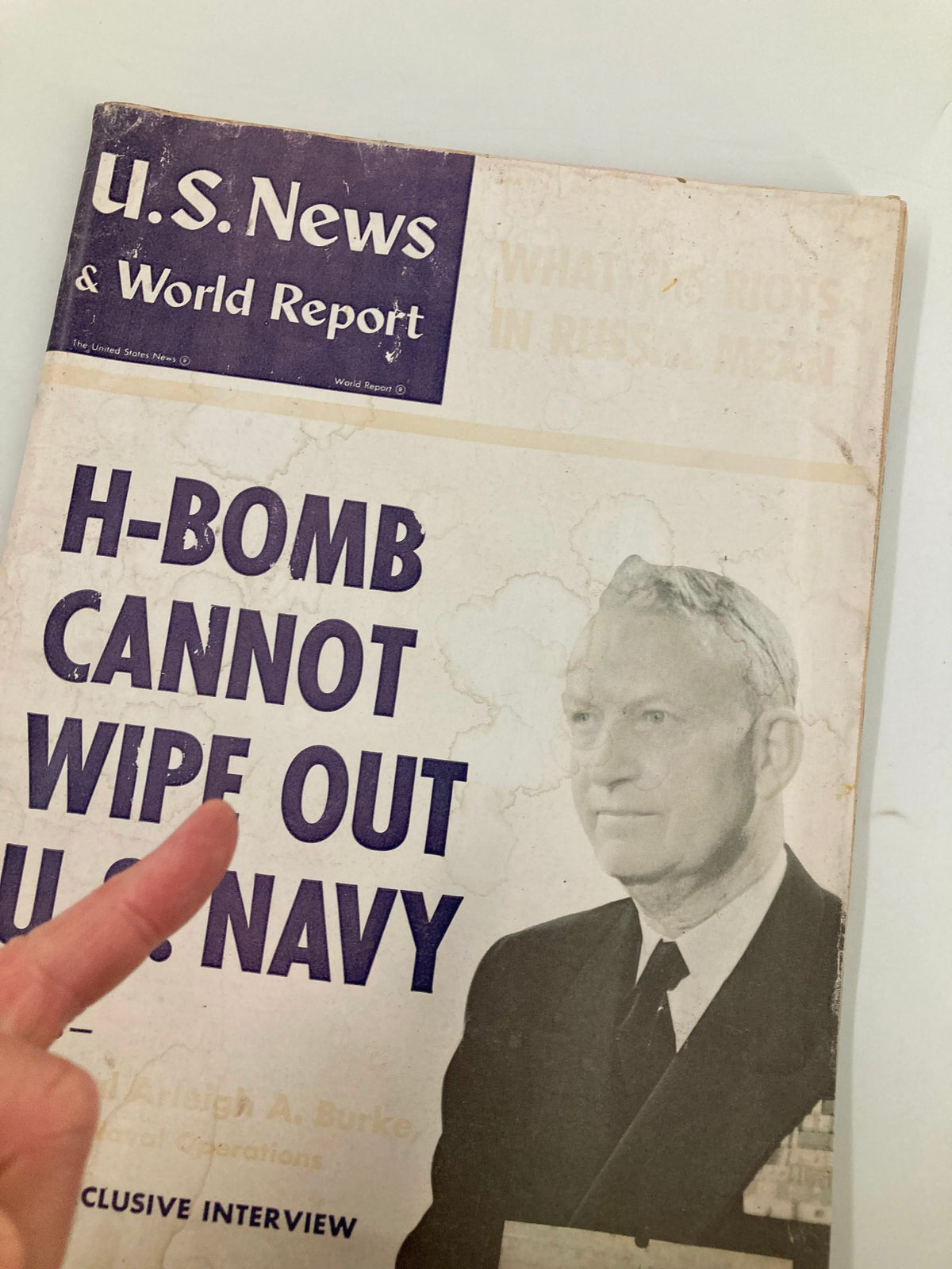 Close-up of the cover of US News & World Report Magazine May 4, 1956, featuring the text 'H-Bomb Cannot Wipe Out U.S. Navy' with Admiral Arleigh A. Burke's image.