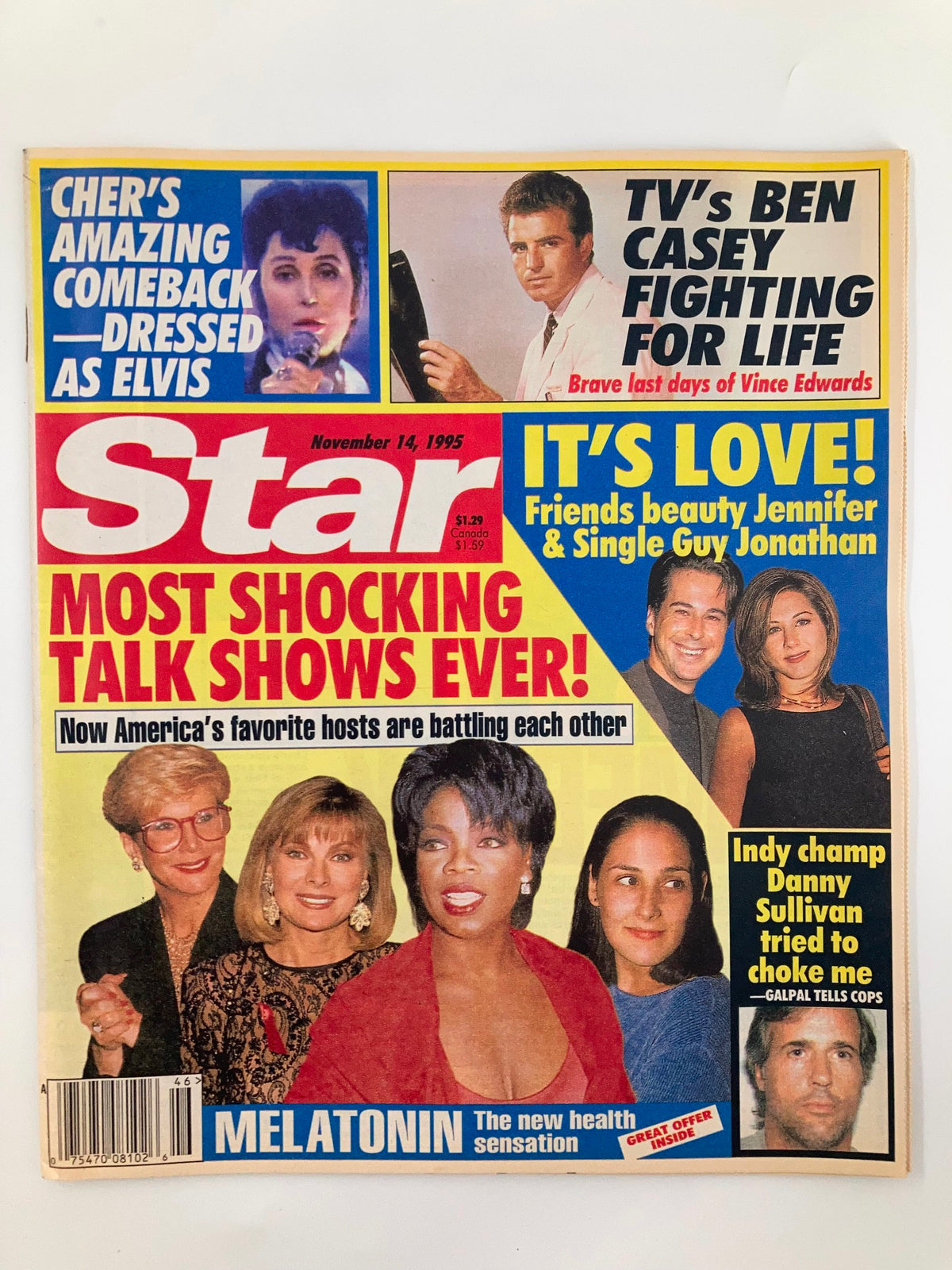 Star Tabloid Magazine November 14 1995 featuring headlines about Cher's comeback as Elvis, Ben Casey's health struggles, Jennifer Aniston's love life, Oprah Winfrey, and a feature on talk shows. The cover highlights celebrity news with colorful graphics.