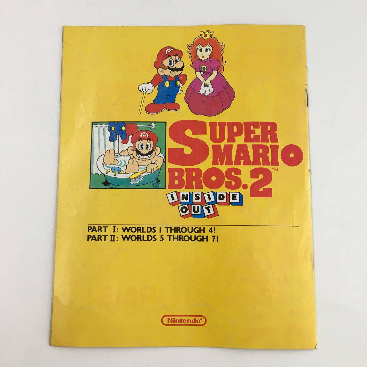 Cover of Nintendo Power Magazine 1989 featuring Super Mario Bros 2 Inside Out. The vibrant yellow cover displays Mario and Princess Peach alongside gameplay hints. Ideal for vintage gaming collectors.