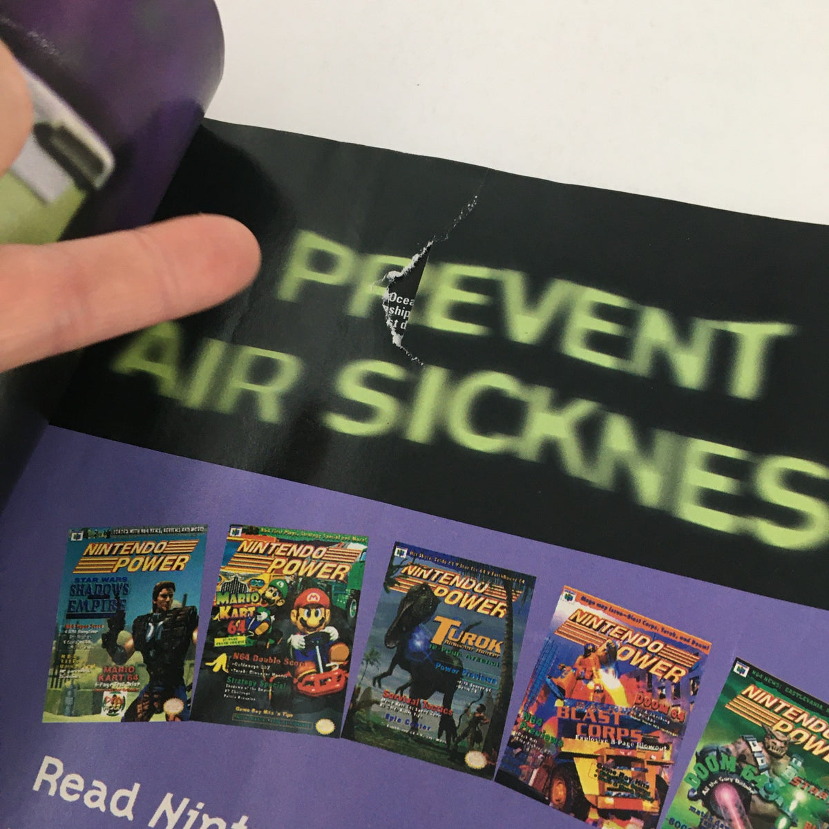 Interior page of Nintendo Power Magazine August 1997 showing an article on preventing air sickness and featuring Nintendo Power cover images.