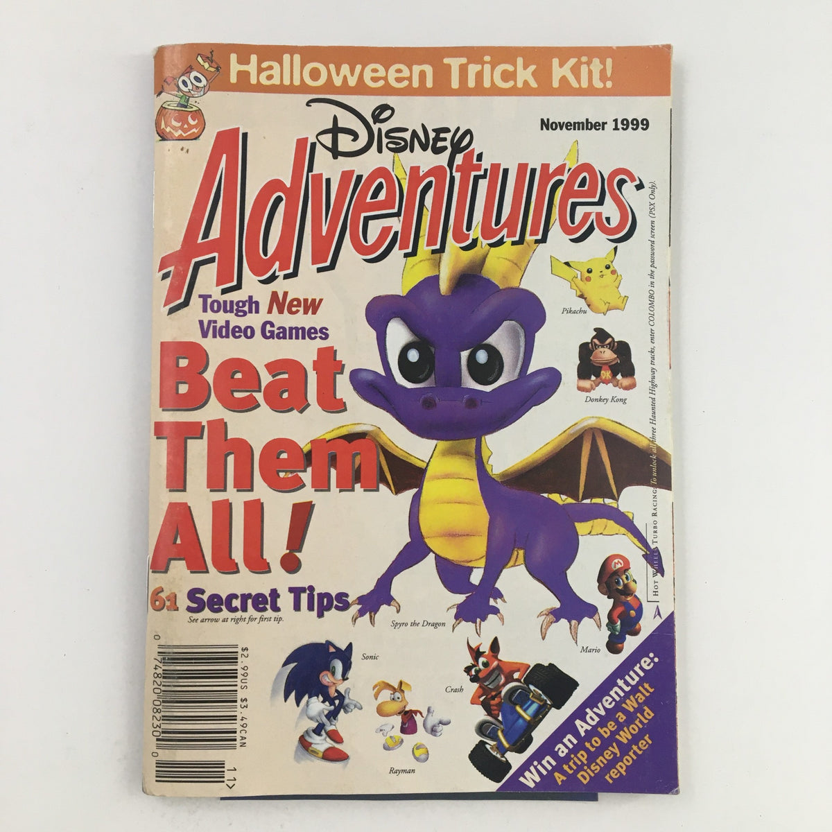 Disney Adventures Magazine November 1999 featuring Donkey Kong and Pokémon on the cover, showcasing a colorful illustration of characters including Spyro the Dragon and Pikachu, along with game tips and a Halloween Trick Kit promotion.