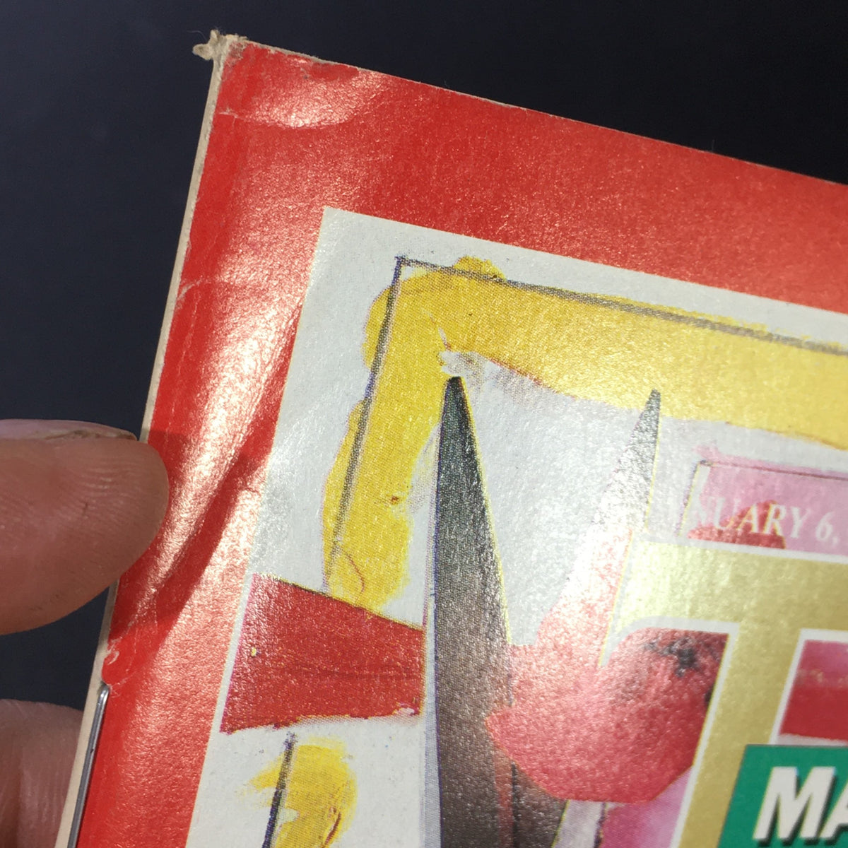 Close-up of the top corner of the vintage Time Magazine, January 8, 1986, featuring signs of wear, highlighting the magazine's age and authenticity.