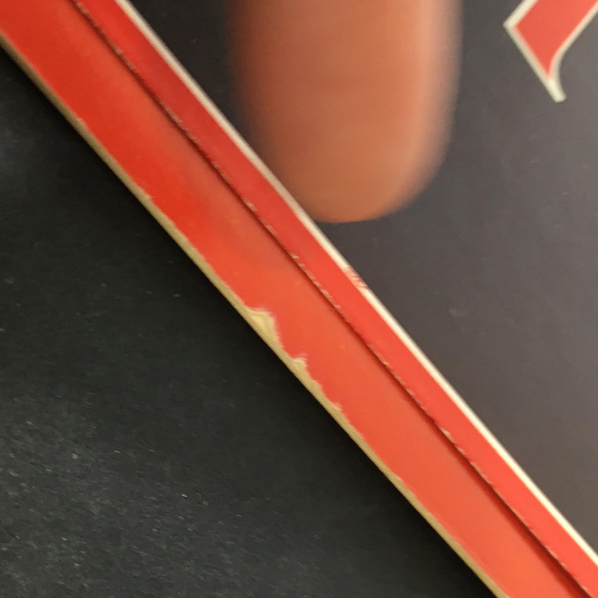 Close-up view of the edge of VTG Time Magazine January 5 1987, showcasing minor wear and a pristine cover featuring Philippine President Corazon Aquino. Represents the collectible nature and age of this historical artifact.