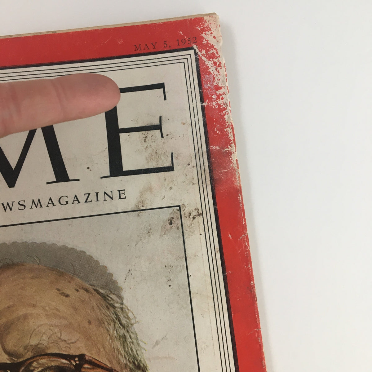 Close-up view of the cover of Time Magazine May 5 1952 Vol LIX No. 18 with the publication date and 'TIME' prominently displayed, highlighting wear consistent with its vintage age.