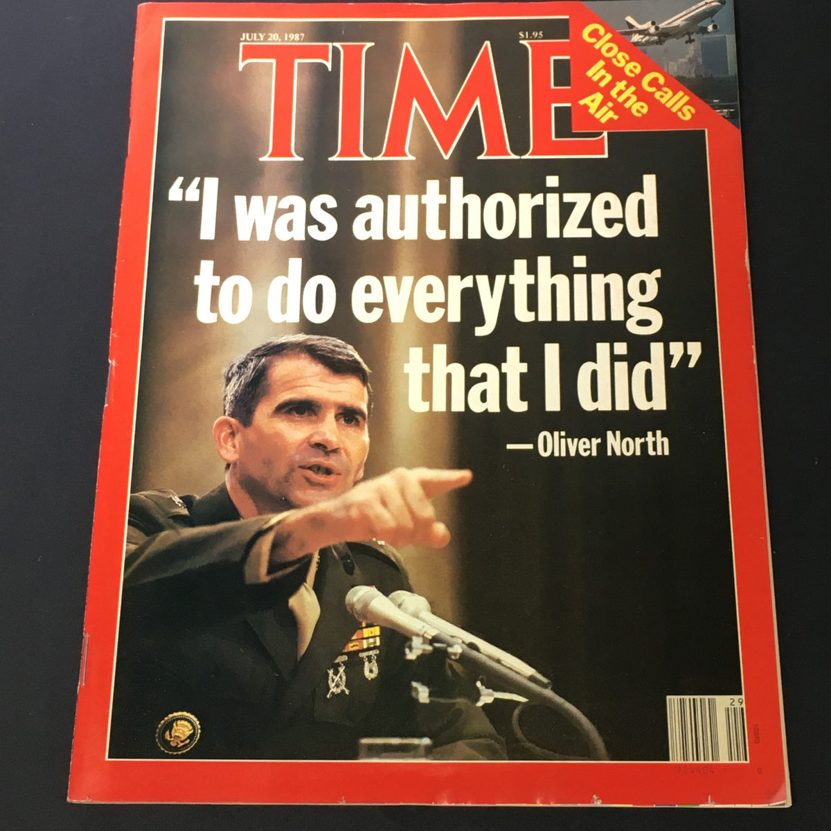 Vintage Time Magazine from July 20, 1987 featuring Oliver North. The cover highlights a quote from Oliver North, discussing his actions, along with the theme 'Close Calls in the Air'.