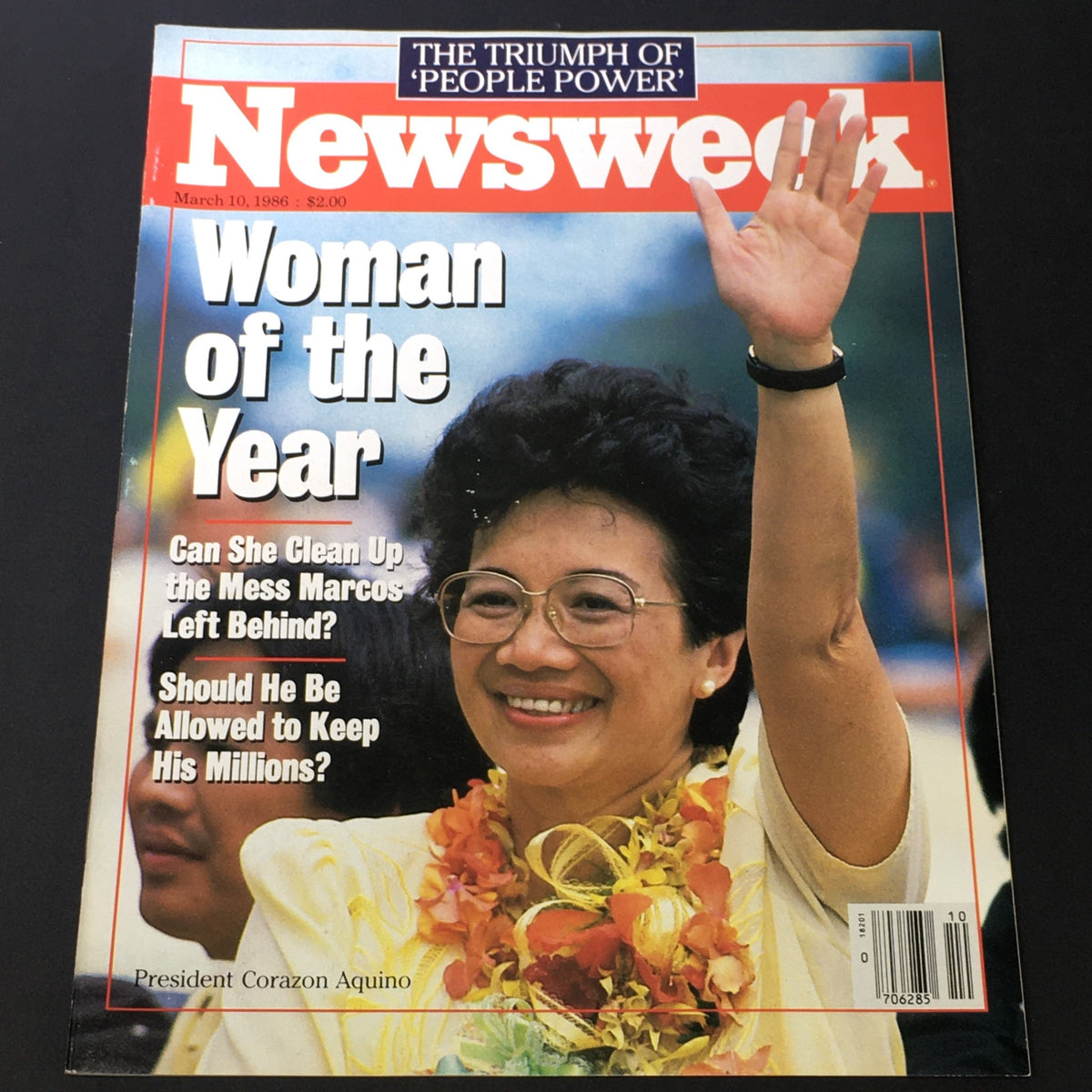 Cover of VTG Newsweek Magazine March 10, 1986 featuring President Corazon Aquino, honored as Woman of the Year, with a vibrant photo of Aquino smiling and waving. The cover includes headlines regarding her leadership and the challenges ahead.