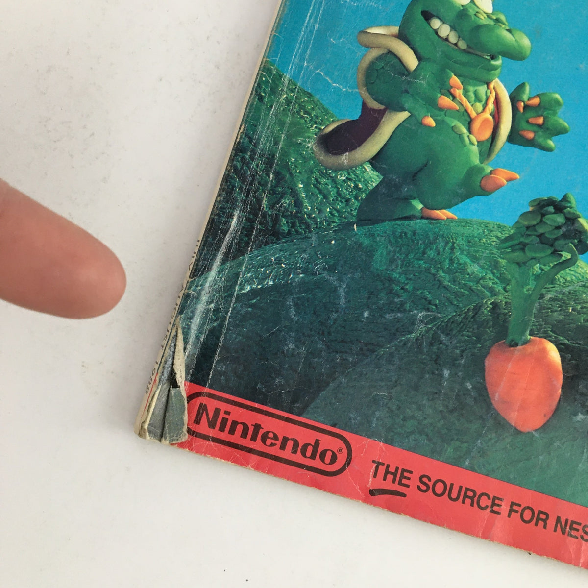 Back cover of Nintendo Power Magazine July 1988 displaying character artwork and the Nintendo logo, highlighting wear and tear consistent with age.