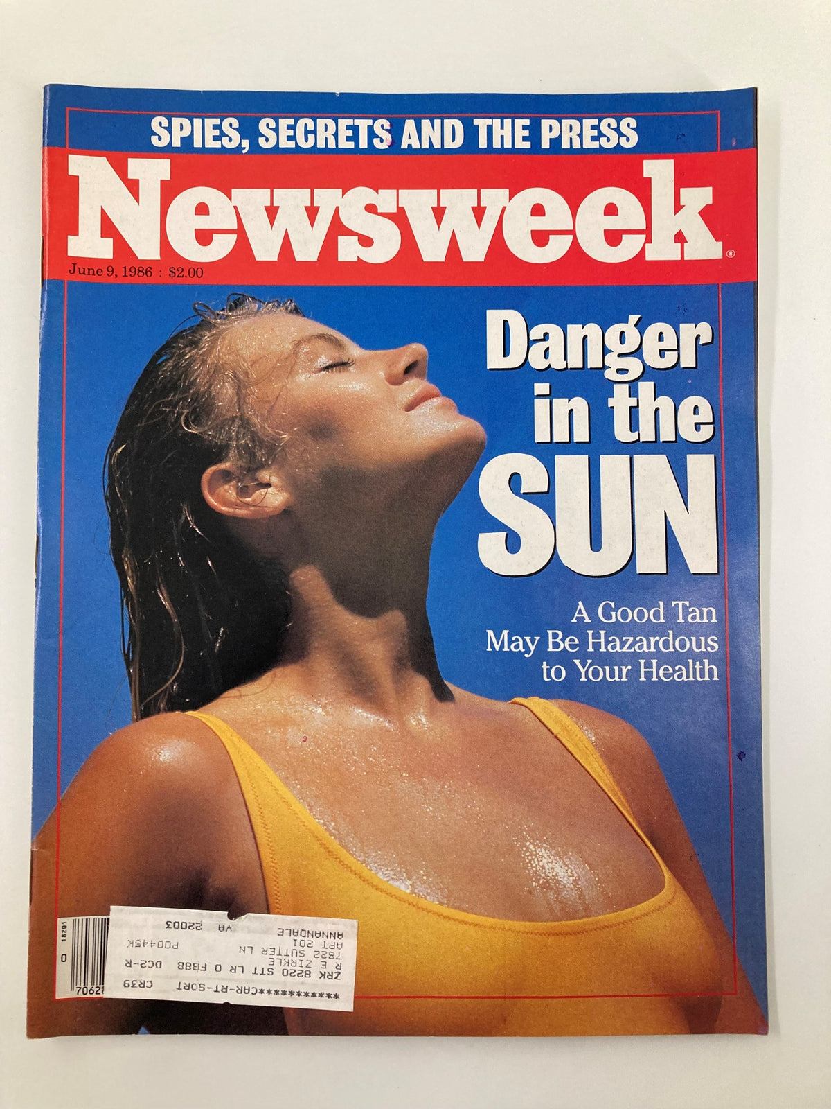 Vintage Newsweek Magazine cover from June 9, 1986 titled 'A Good Tan May Be Hazardous To Your Health' featuring a woman with wet hair in a yellow swimsuit, highlighting the article 'Danger in the Sun.'