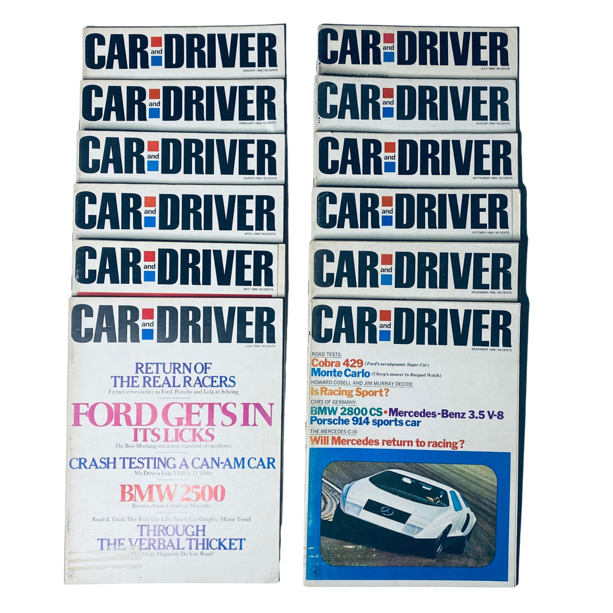 Collection of 12 Car and Driver magazines for the year 1969, showcasing iconic automotive history and features from January to December.