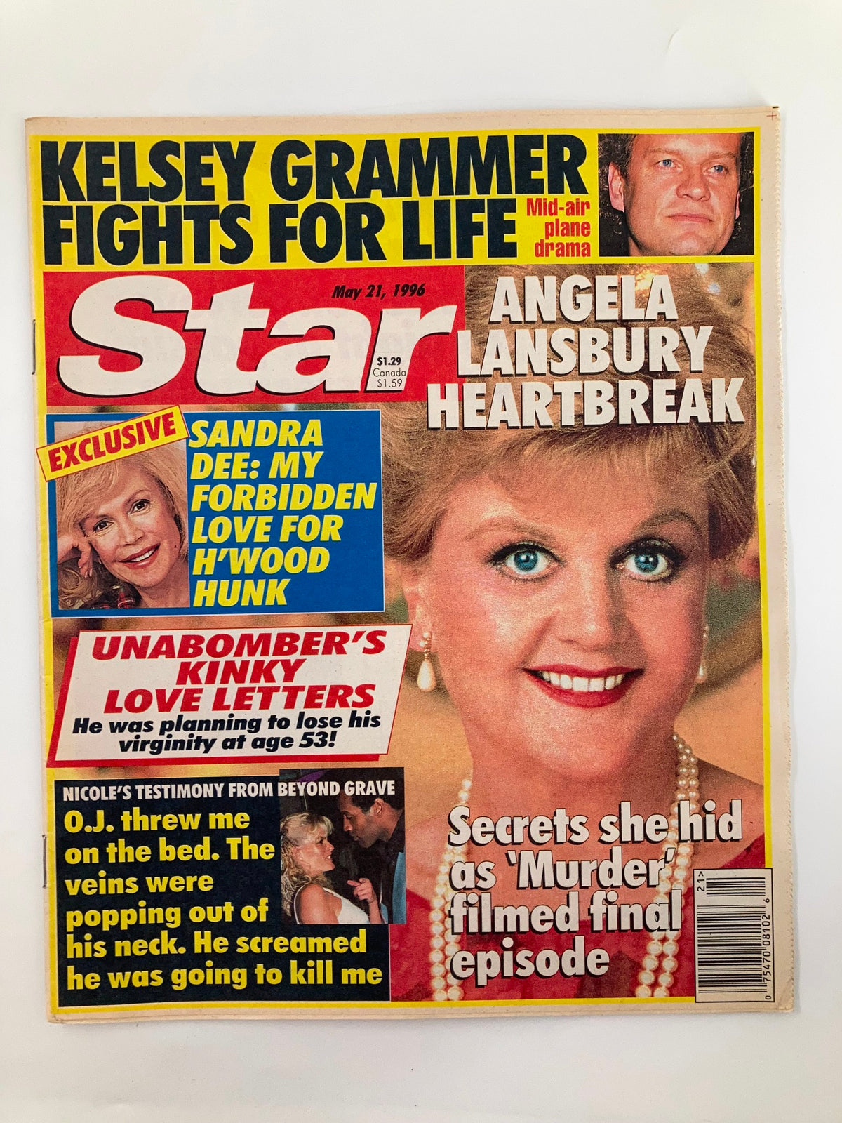 Cover of Star Tabloid Magazine from May 21, 1996 featuring articles on Angela Lansbury and Sandra Dee, highlighting topics such as heartbreak and celebrity news. This collectible vintage magazine is a piece of entertainment history.