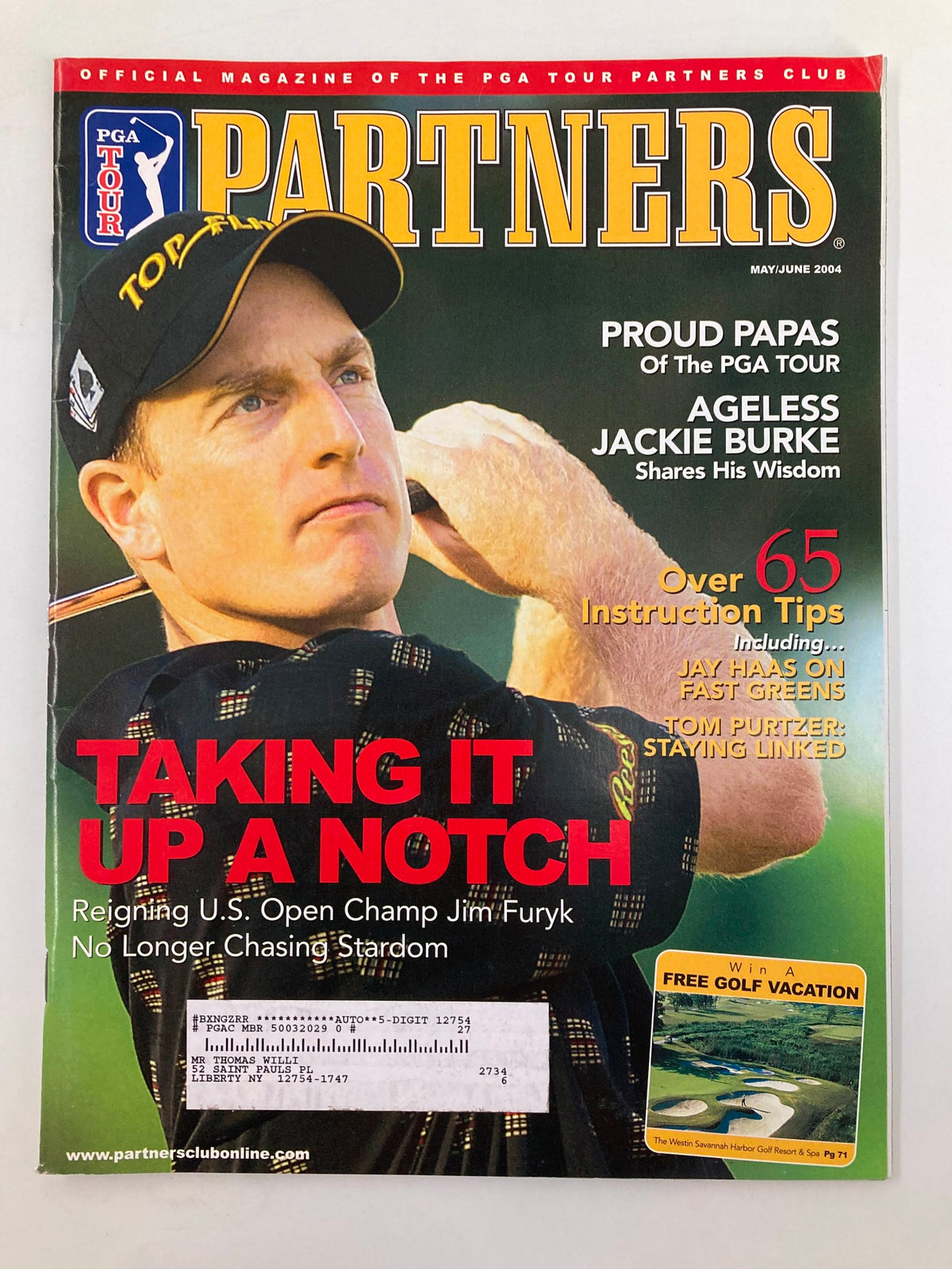 PGA Tour Partners May 2004 magazine cover featuring reigning U.S. Open Champion Jim Furyk with the headline 'Taking It Up a Notch.' The magazine highlights over 65 instruction tips and features related articles.