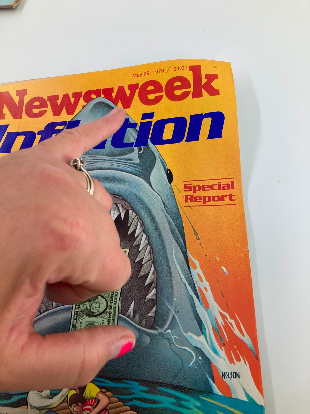 Close-up of the cover of vintage Newsweek magazine dated May 29, 1978, showcasing the inflation theme with a shark and a woman pointing at the dollar bill, emphasizing the special report.