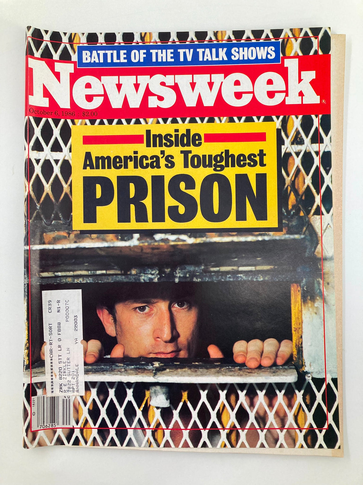 Vintage Newsweek magazine from October 6, 1986, featuring the article 'Inside America's Toughest Prison' with a striking cover image of a man looking through prison bars.