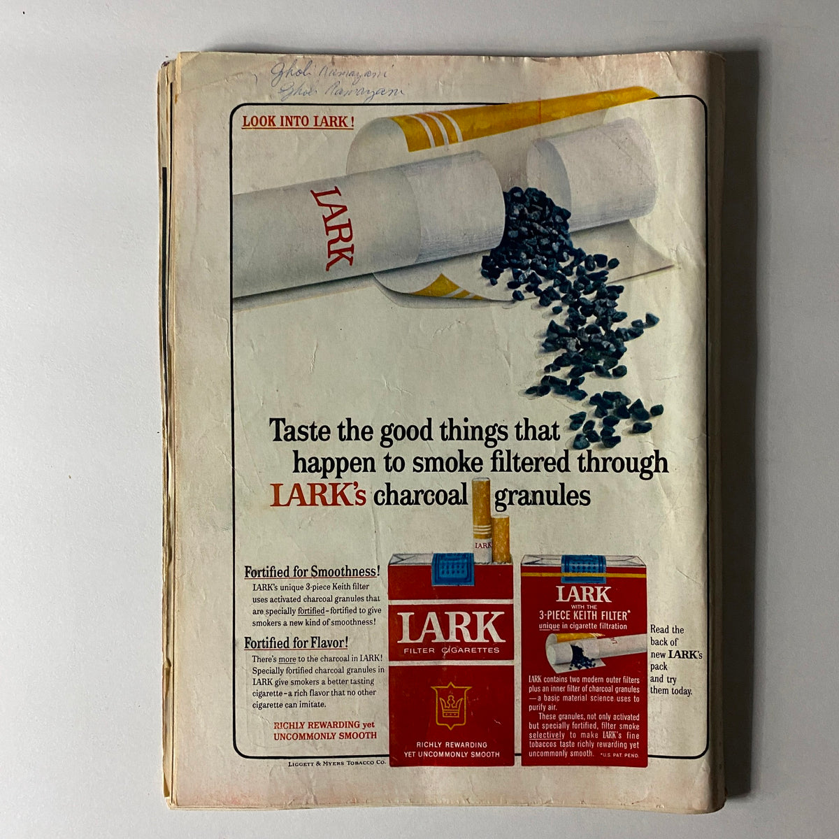 Back cover of VTG Time Magazine September 11 1964 showcasing an advertisement for Lark cigarettes, highlighting the unique features of Lark's filter and charcoal granules for a smooth smoking experience.