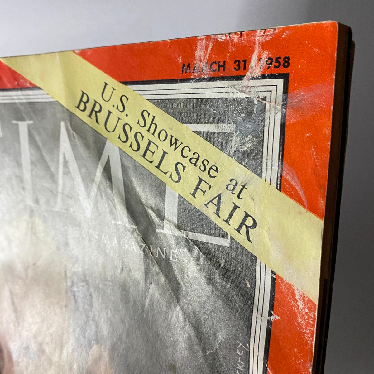 Side view of VTG Time Magazine March 31, 1958 displaying the U.S. Showcase at Brussels Fair ribbon, highlighting its collectible value.
