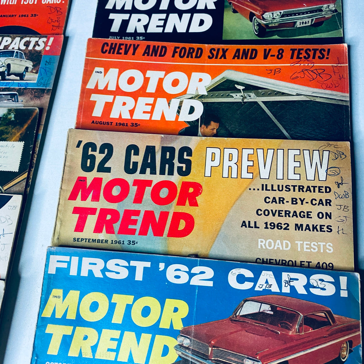 Lot of 12 Motor Trend Magazine covers from August 1961 to September 1961, highlighting car tests and previews of new models.