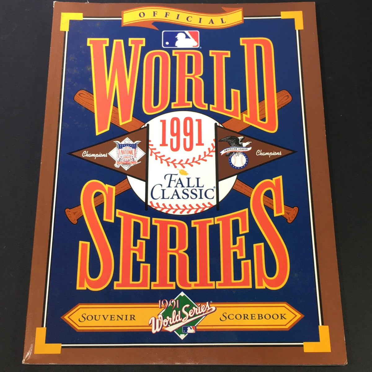 VTG MLB Official Scorebook 1991 The Fall Classic World Series cover featuring bold colors and baseball graphics including the official logo.