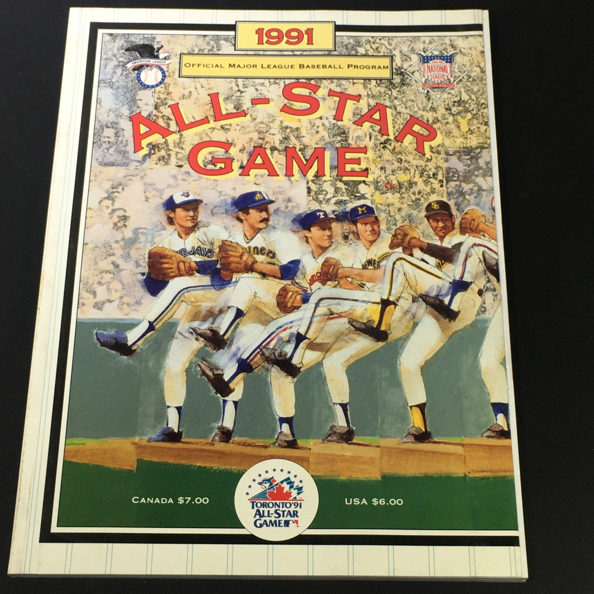 Cover of the VTG MLB Official Program 1991 All-Star Game featuring players from the California Angels, showcasing vibrant colors and artwork, ideal for baseball collectors.