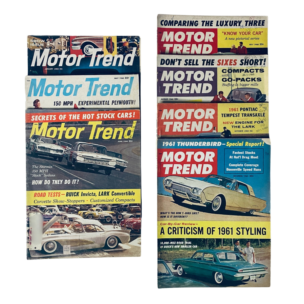 Lot of 7 Motor Trend Magazine issues from 1960 including January, May, June, July, August, October, and December showing classic cars, road tests, and vintage automotive content.