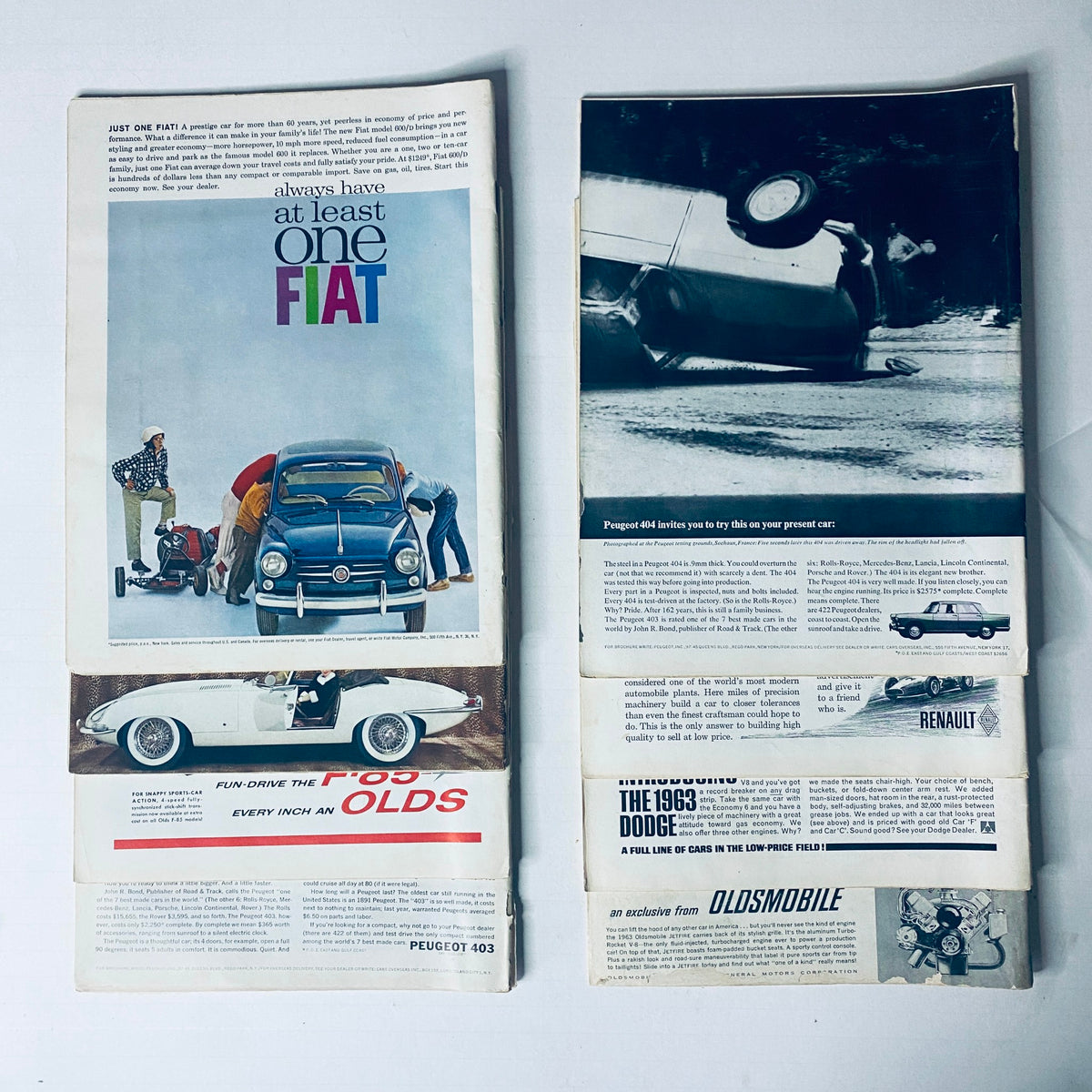 Lot of 8 Car Life Magazines, including an interior spread from 1962 showcasing advertisements and automotive content relevant to vintage car enthusiasts.