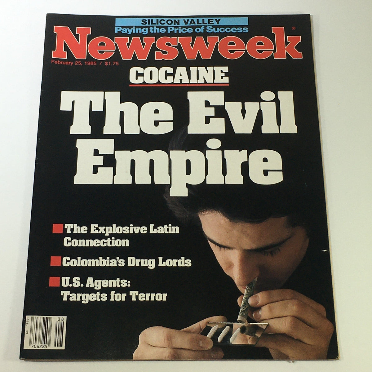 Vintage Newsweek Magazine February 25, 1985, featuring a cover story on cocaine titled 'The Evil Empire,' discussing the explosive Latin connection and Colombia's drug lords.