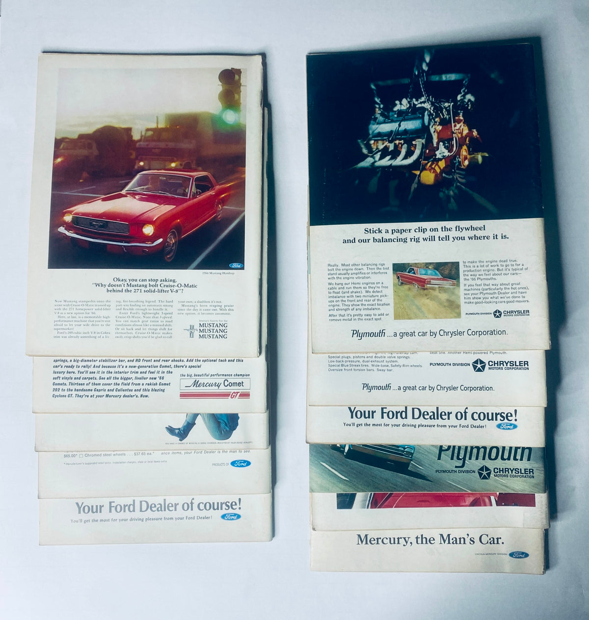 Collection of vintage car advertisements from the 1966 Car Life Magazine, including promotional material for the Mustang and Plymouth, showcasing classic vehicles and marketing strategies of the era.