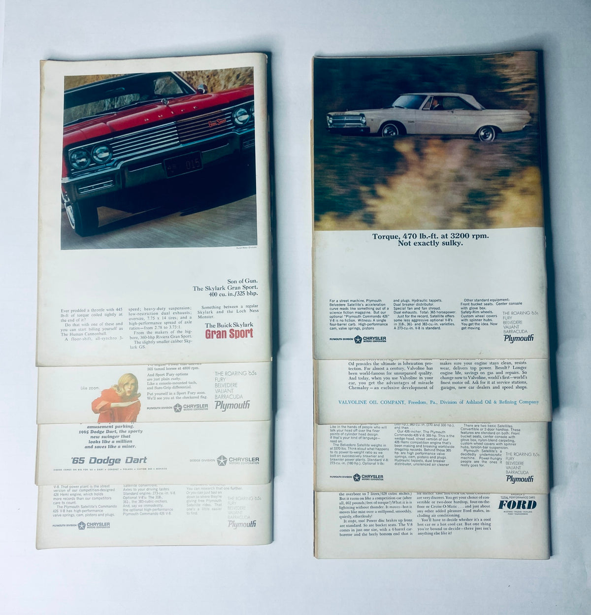 Back covers of the Lot of 8 Car Life Automotive Magazines showcasing advertisements for classic cars like the '65 Dodge Dart and vintage Plymouth models.