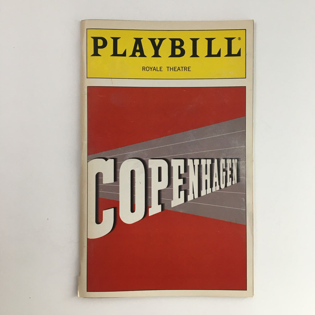 2000 Playbill for the Royale Theatre production of Copenhagen by Michael Frayn, featuring a bold red and gray design with the title prominently displayed.