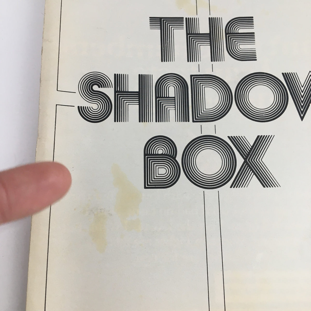 Close-up of the 1977 Playbill for The Shadow Box, highlighting the title and minor wear on the cover.
