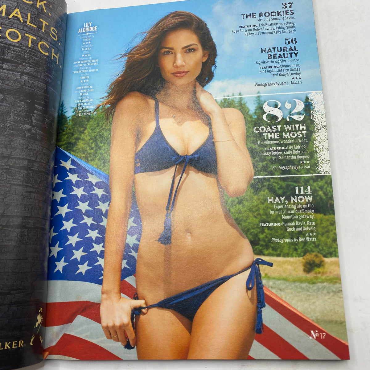 Inside page of Sports Illustrated Magazine 2015 featuring Lily Aldridge in a bikini, posing confidently with a patriotic American flag in the background, highlighting the blend of sports and beauty.