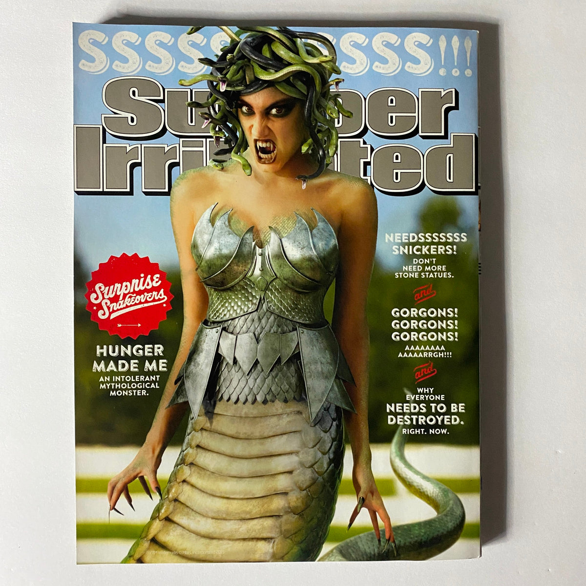 Sports Illustrated Magazine 2015 featuring a striking cover with an artistic depiction of a Gorgon, blending themes of sports and mythical mythology, showcasing unique creative design.