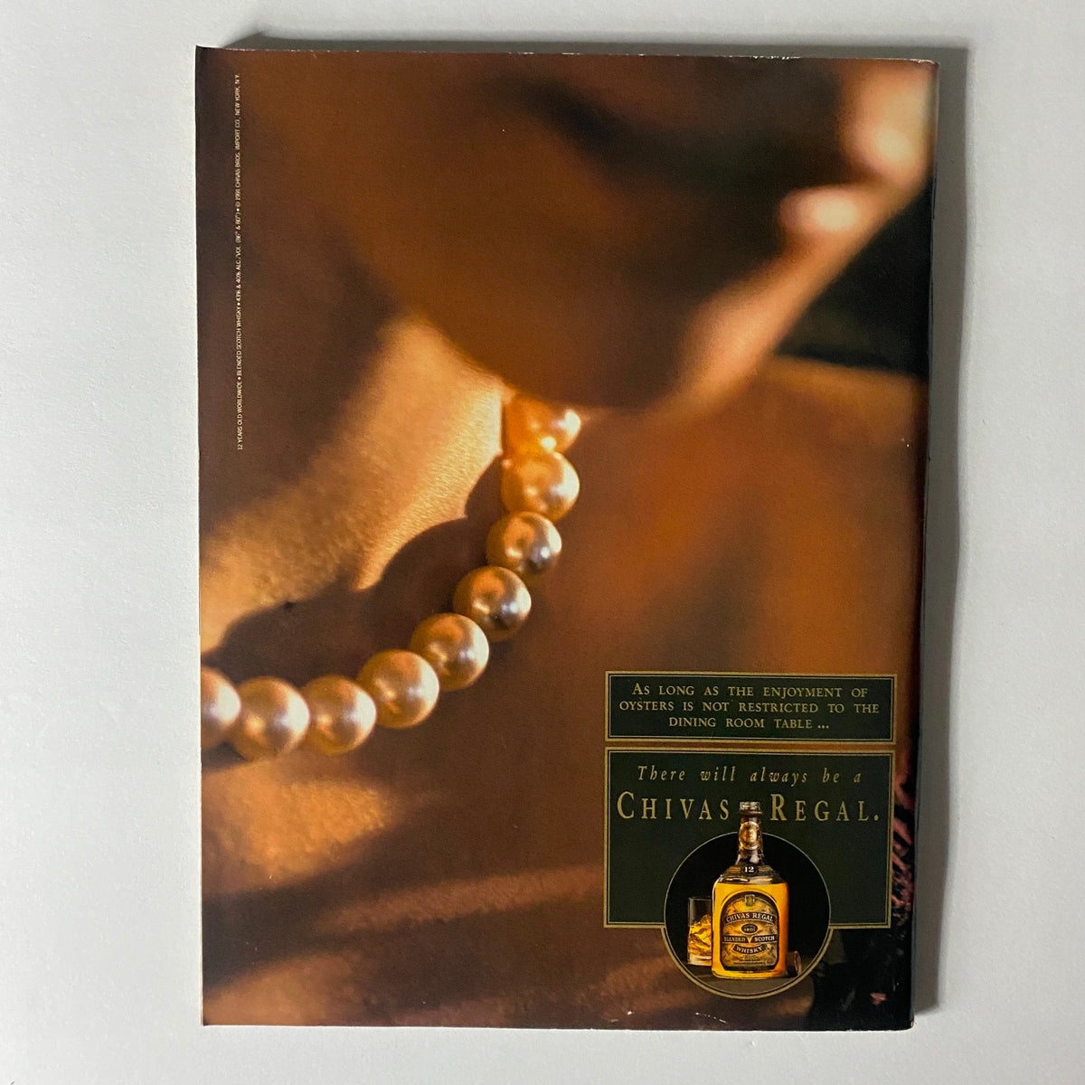 Back cover of Sports Illustrated Magazine March 9, 1992 featuring a close-up of a pearl necklace with an advertisement for Chivas Regal whiskey.