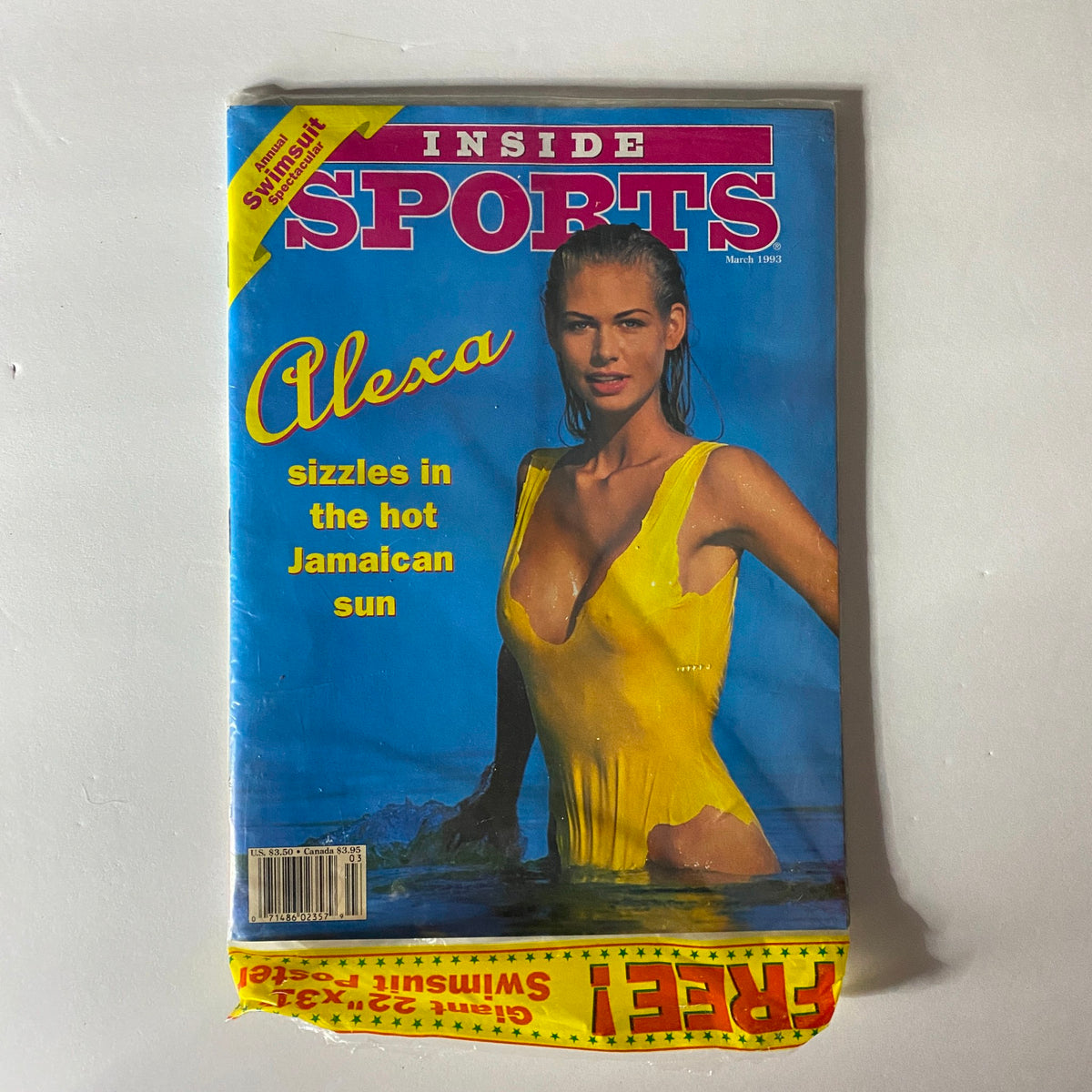 Back cover and original protective plastic of Inside Sports Magazine, March 1993, featuring Alexa in a yellow swimsuit, emphasizing its collectible condition.