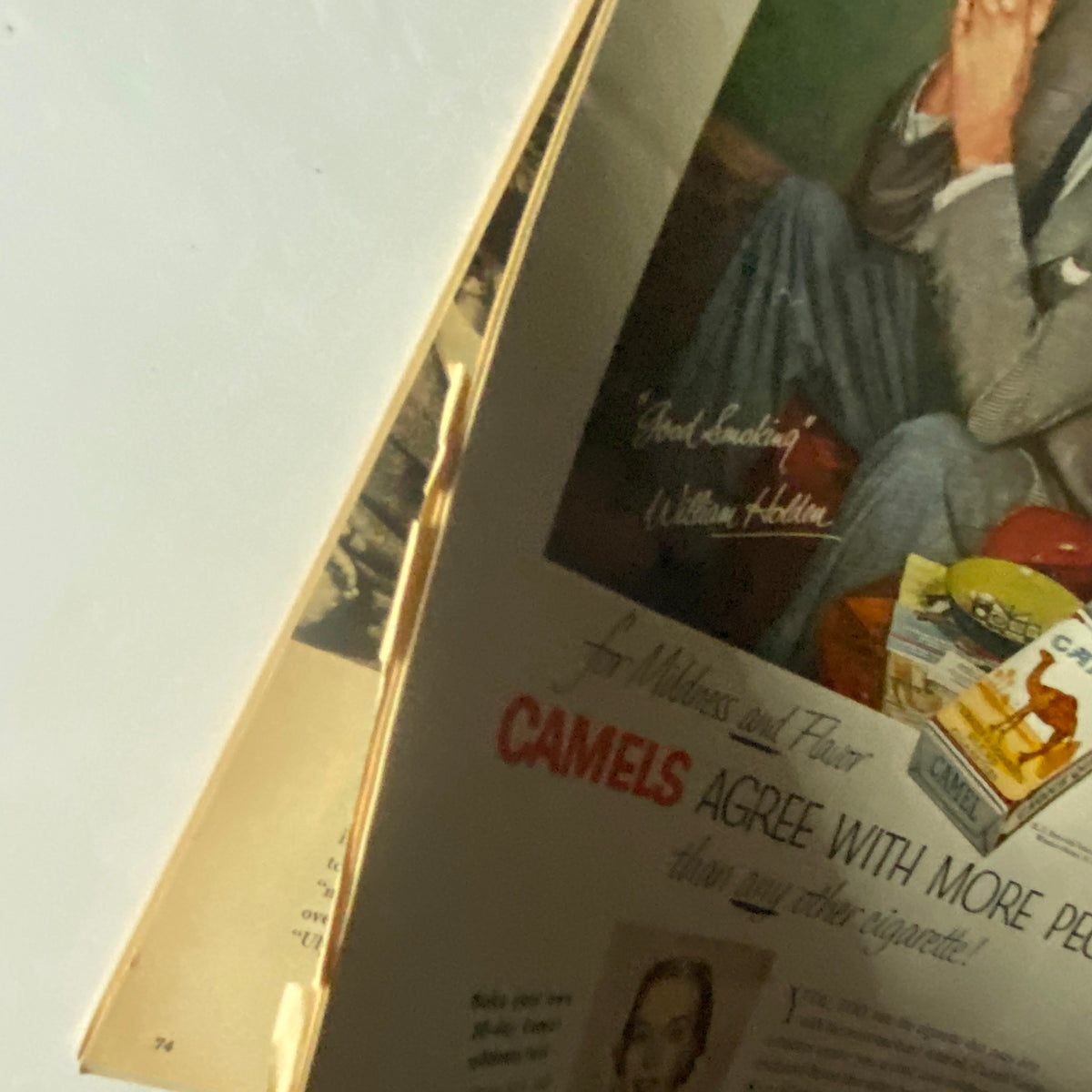 Close-up of the Camels cigarette advertisement with William Holden from the VTG Photoplay Magazine March 1954. The ad showcases the vintage design and promotional style of the era.