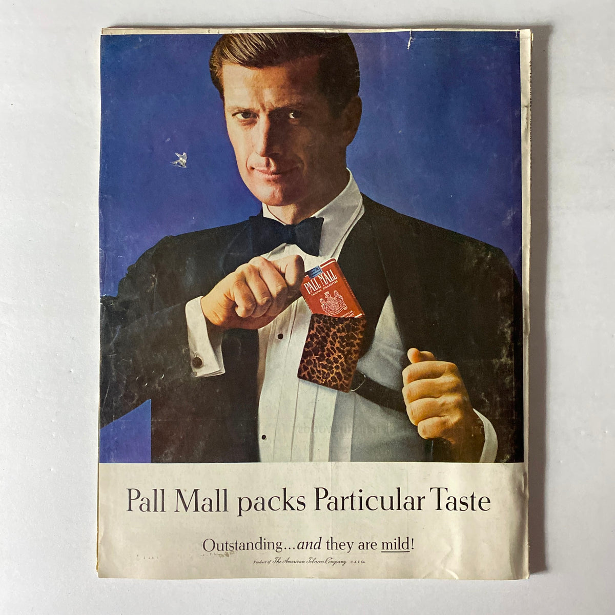 Vintage advertisement from VTG Holiday Magazine September 1965 featuring a man in a tuxedo promoting Pall Mall cigarettes with the tagline 'Outstanding...and they are mild!'.