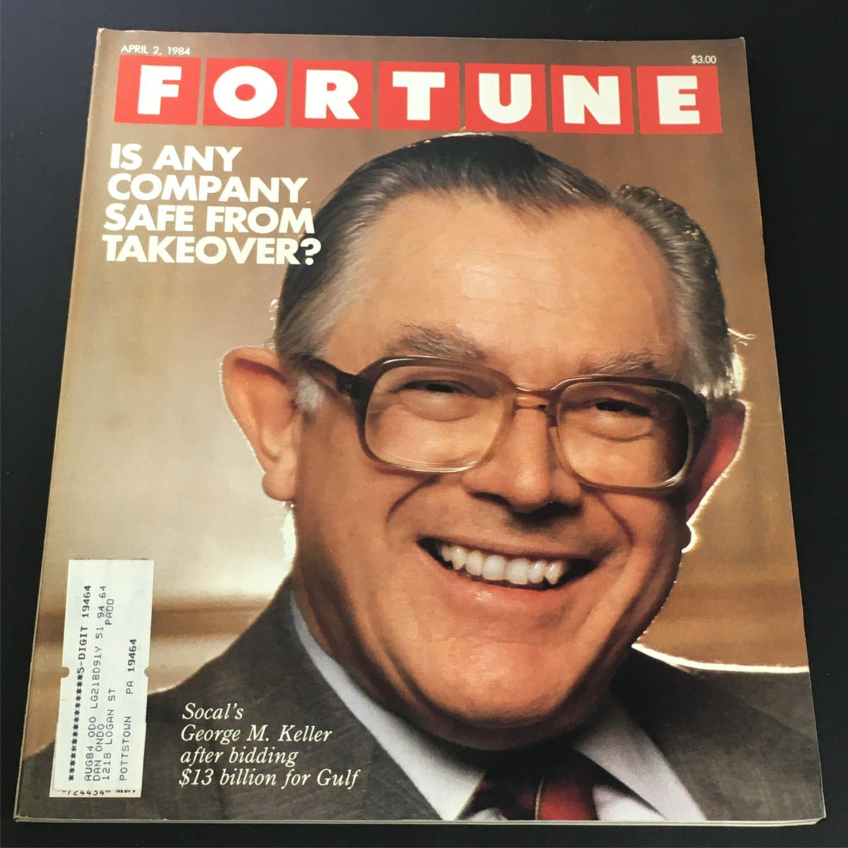Cover of Fortune Magazine from April 2, 1984, featuring the title 'VTG Fortune Magazine April 2 1984 - Socal's George M. Keller After Bidding'. The cover headline reads 'IS ANY COMPANY SAFE FROM TAKEOVER?' and showcases a smiling George M. Keller, with an address label visible in the corner, highlighting the magazine's status as a collectible vintage publication.